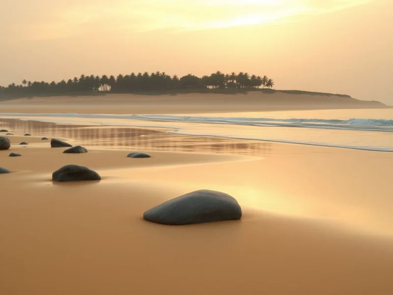Empty golden sand beach on the Coromandel coast near Mahabalipuram at sunrise with granite boulders on the sand and casuarina along the dune